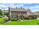 Beautiful brick home featuring a well-kept lawn and meticulously trimmed bushes and flowerbeds at 195 Lake Dr, Greenwood, IN 46142