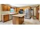 Bright kitchen with stainless steel appliances and breakfast bar area at 195 Lake Dr, Greenwood, IN 46142