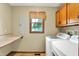 Functional laundry room with modern appliances, countertop space and cabinets for storage at 195 Lake Dr, Greenwood, IN 46142