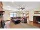 Inviting living room with a brick fireplace, ceiling fan, and a comfortable sectional sofa at 195 Lake Dr, Greenwood, IN 46142