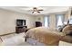 Comfortable main bedroom with a TV, large bed, and plenty of natural light at 195 Lake Dr, Greenwood, IN 46142