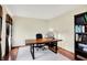 Office featuring hardwood floors, a spacious desk, a bookcase, and a bright window for natural light at 195 Lake Dr, Greenwood, IN 46142