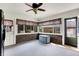 Bright sunroom with brick accent wall, lots of windows, and a door to the backyard at 195 Lake Dr, Greenwood, IN 46142