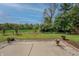 Scenic backyard with mature trees and a concrete patio at 2557 Cedarcrest Dr, Columbus, IN 47203