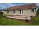 Backyard patio with sliding glass door to the home at 2557 Cedarcrest Dr, Columbus, IN 47203
