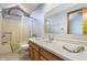 Bathroom boasts a shower-tub combo and vanity with countertop space at 2557 Cedarcrest Dr, Columbus, IN 47203