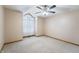 Bedroom featuring a ceiling fan and large window at 2557 Cedarcrest Dr, Columbus, IN 47203