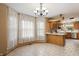 The dining area offers ample lighting and features a window view and is connected to the kitchen at 2557 Cedarcrest Dr, Columbus, IN 47203