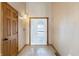 Bright foyer featuring a decorative glass front door, tiled flooring, and paneled wooden door at 2557 Cedarcrest Dr, Columbus, IN 47203