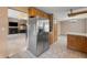 This eat-in kitchen has stainless steel appliances and an open view to the living area at 2557 Cedarcrest Dr, Columbus, IN 47203