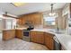 Traditional kitchen featuring wood cabinets, stainless steel appliances, and bright white countertops at 2557 Cedarcrest Dr, Columbus, IN 47203