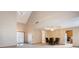 Open-concept living area with high ceilings, dining space, and tiled entryway at 2557 Cedarcrest Dr, Columbus, IN 47203