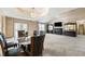 Open living space featuring dining area, fireplace, display cabinets, and neutral color palette at 2557 Cedarcrest Dr, Columbus, IN 47203