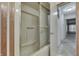 Bright bathroom with sliding glass shower doors and neutral color scheme in a well-maintained home at 3008 Old State Road 37, Greenwood, IN 46143