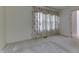 Bright bedroom featuring neutral carpet, light walls, and large window with floral curtains at 3008 Old State Road 37, Greenwood, IN 46143