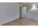 Bedroom with wood flooring, closet, light walls, and modern lighting at 3008 Old State Road 37, Greenwood, IN 46143