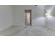 Simple bedroom with neutral carpet and light walls, illuminated by a floor lamp at 3008 Old State Road 37, Greenwood, IN 46143