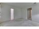 Spacious bedroom with neutral carpet, light walls, and adjoining hallways at 3008 Old State Road 37, Greenwood, IN 46143