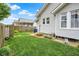 A well-manicured lawn and brick path highlight this backyard at 301 Colescott St, Shelbyville, IN 46176