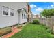 A fenced backyard with mature landscaping and a brick walkway at 301 Colescott St, Shelbyville, IN 46176