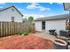 A charming brick patio and quaint white garage accent this backyard at 301 Colescott St, Shelbyville, IN 46176