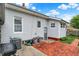 Well-maintained backyard featuring a brick patio and gray siding at 301 Colescott St, Shelbyville, IN 46176