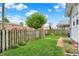 Beautifully landscaped backyard with a lush green lawn and a wooden fence at 301 Colescott St, Shelbyville, IN 46176