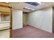 Unfinished basement space featuring shelving on the left side and access to stairs in the back of the room at 301 Colescott St, Shelbyville, IN 46176