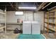 Basement laundry area with washer, dryer, countertop, and utilitarian shelving at 301 Colescott St, Shelbyville, IN 46176