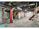 Unfinished basement featuring open ceiling, water heater, HVAC, and utilitarian shelving at 301 Colescott St, Shelbyville, IN 46176