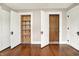 Bedroom featuring hardwood floors and two closets with custom organizers at 301 Colescott St, Shelbyville, IN 46176