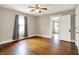 Bright bedroom with hardwood floors, ceiling fan, and natural light at 301 Colescott St, Shelbyville, IN 46176