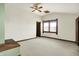 Large carpeted bedroom features a ceiling fan, a window, and a walk-in closet at 301 Colescott St, Shelbyville, IN 46176