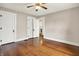 Bedroom with hardwood floors and a large closet, and an open doorway to another room at 301 Colescott St, Shelbyville, IN 46176