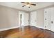 Bedroom featuring hardwood floors, white trim, two closet doors and an entrance to another room at 301 Colescott St, Shelbyville, IN 46176