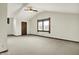 Spacious bedroom with vaulted ceilings, carpet, and a large window at 301 Colescott St, Shelbyville, IN 46176
