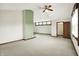 A large bedroom featuring neutral carpeting, a ceiling fan, and a walk-in closet at 301 Colescott St, Shelbyville, IN 46176