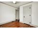 Bright bedroom featuring hardwood floors, white walls, closet door, and ceiling fan at 301 Colescott St, Shelbyville, IN 46176