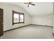 Bright, spacious bedroom featuring carpet, and a large window at 301 Colescott St, Shelbyville, IN 46176