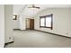 A spacious bedroom with neutral carpeting, ceiling fan, and a walk-in closet at 301 Colescott St, Shelbyville, IN 46176
