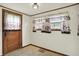 Well-lit breakfast nook with tiled floors and decorative curtains at 301 Colescott St, Shelbyville, IN 46176