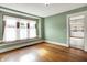 Dining room featuring hardwood floors, a bay window, and an adjacent doorway at 301 Colescott St, Shelbyville, IN 46176
