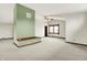 Open living room with carpet, high ceilings, a fireplace, and ample space at 301 Colescott St, Shelbyville, IN 46176