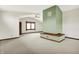 Large living room with carpet, a fireplace, and a bright interior at 301 Colescott St, Shelbyville, IN 46176
