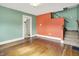 Inviting living room features hardwood floors, an open layout, and staircase at 301 Colescott St, Shelbyville, IN 46176