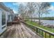 Wide back deck offering beautiful views of the lake with docks, perfect for outdoor enjoyment at 3136 River Bay N Dr, Indianapolis, IN 46240