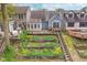 Aerial view of back of home with a multi-tiered deck and tiered garden at 3136 River Bay N Dr, Indianapolis, IN 46240