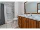 Clean bathroom features a tiled shower and wood vanity at 3136 River Bay N Dr, Indianapolis, IN 46240