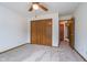 Bedroom features neutral carpet, ceiling fan, and closet space at 3136 River Bay N Dr, Indianapolis, IN 46240