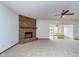 Large living room features stone fireplace, and leads to sunroom at 3136 River Bay N Dr, Indianapolis, IN 46240
